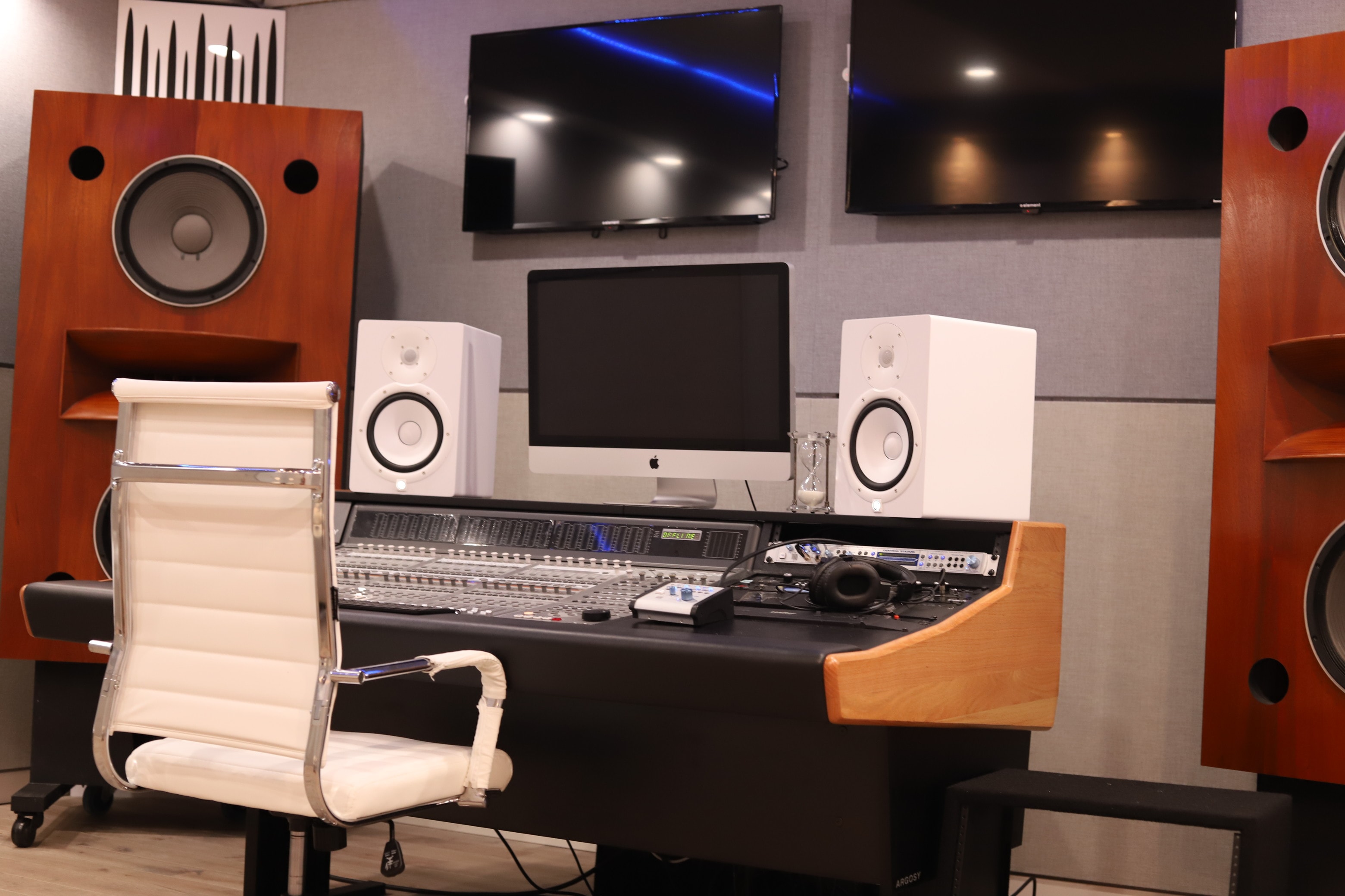Grammy Room — analog mixing console fader and button detail
