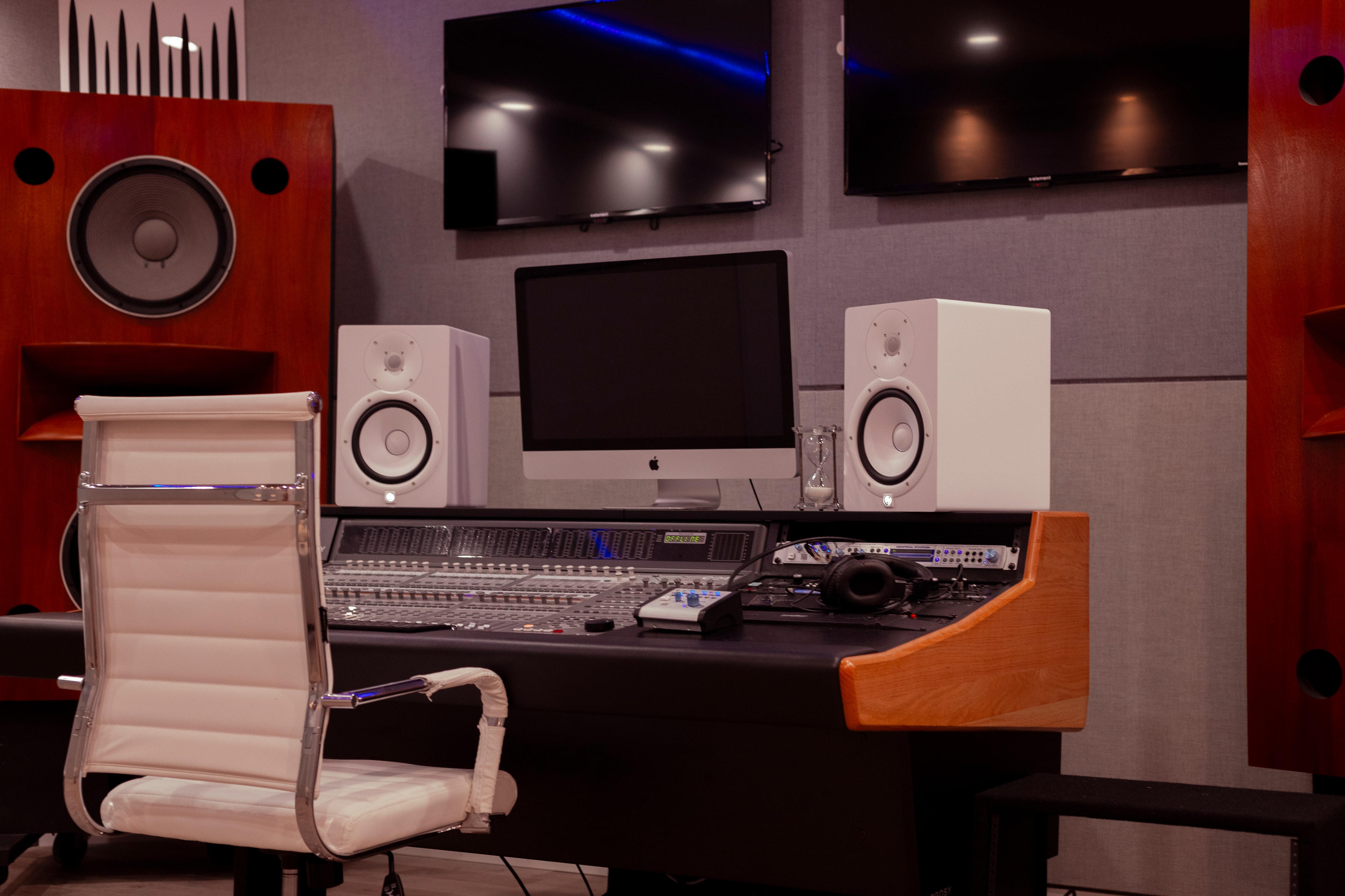 Grammy Room — wide room shot with red-tinted ambient lighting